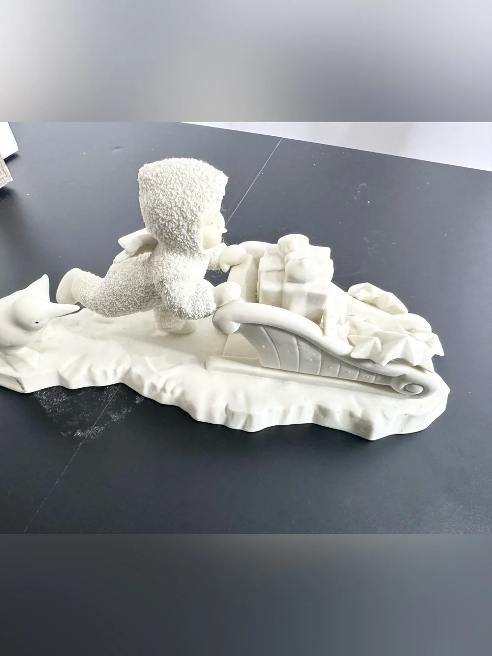 Department 56 Cream Ceramic Angel child on Sled Figurine